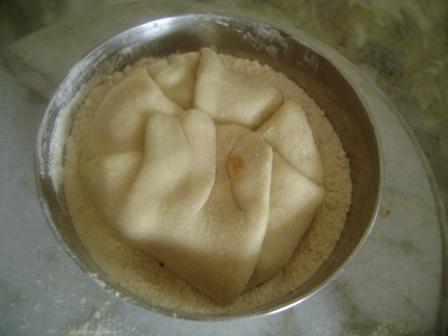 Sprinkle dry wheat flour over the prepared ball of Rajma paratha.